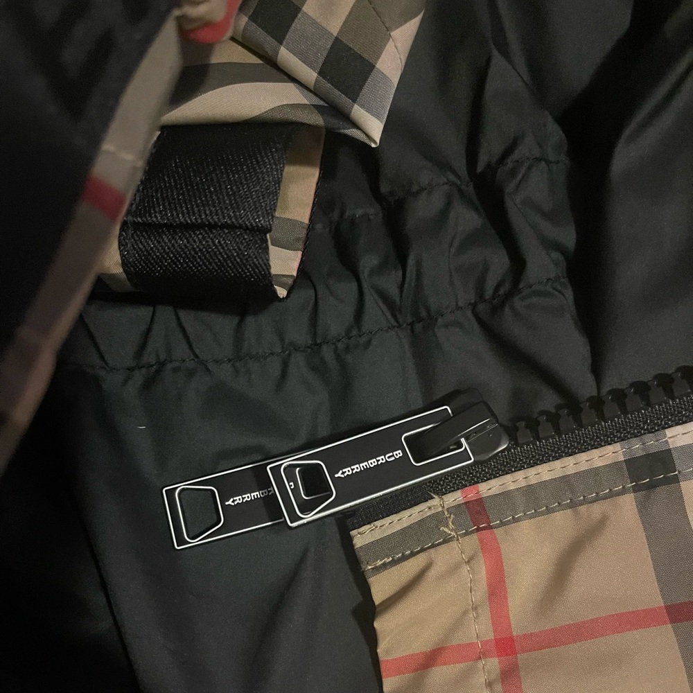 Brand new Burberry rain coat size 8.